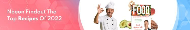 A chef making an okay gesture next to a copy of Mark Hyman's book "Food: What the Heck Should I Eat?" and the text "Neeon Findout The Top Recipes Of 2022."