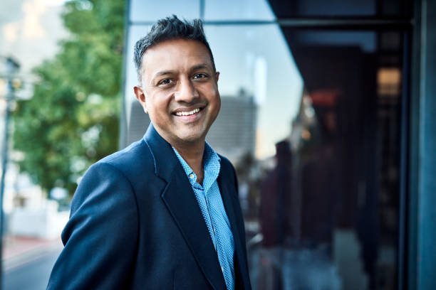 Portrait of a confident businessman standing on an office balcony